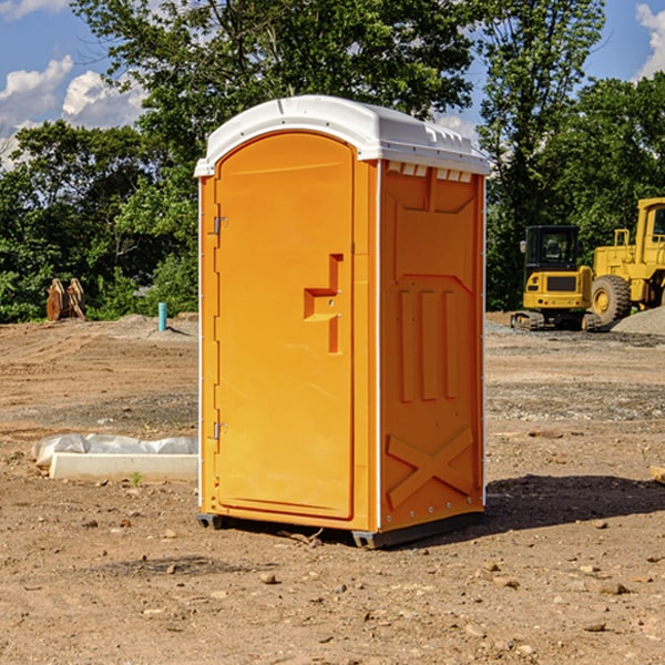 what is the cost difference between standard and deluxe portable toilet rentals in Amber OK